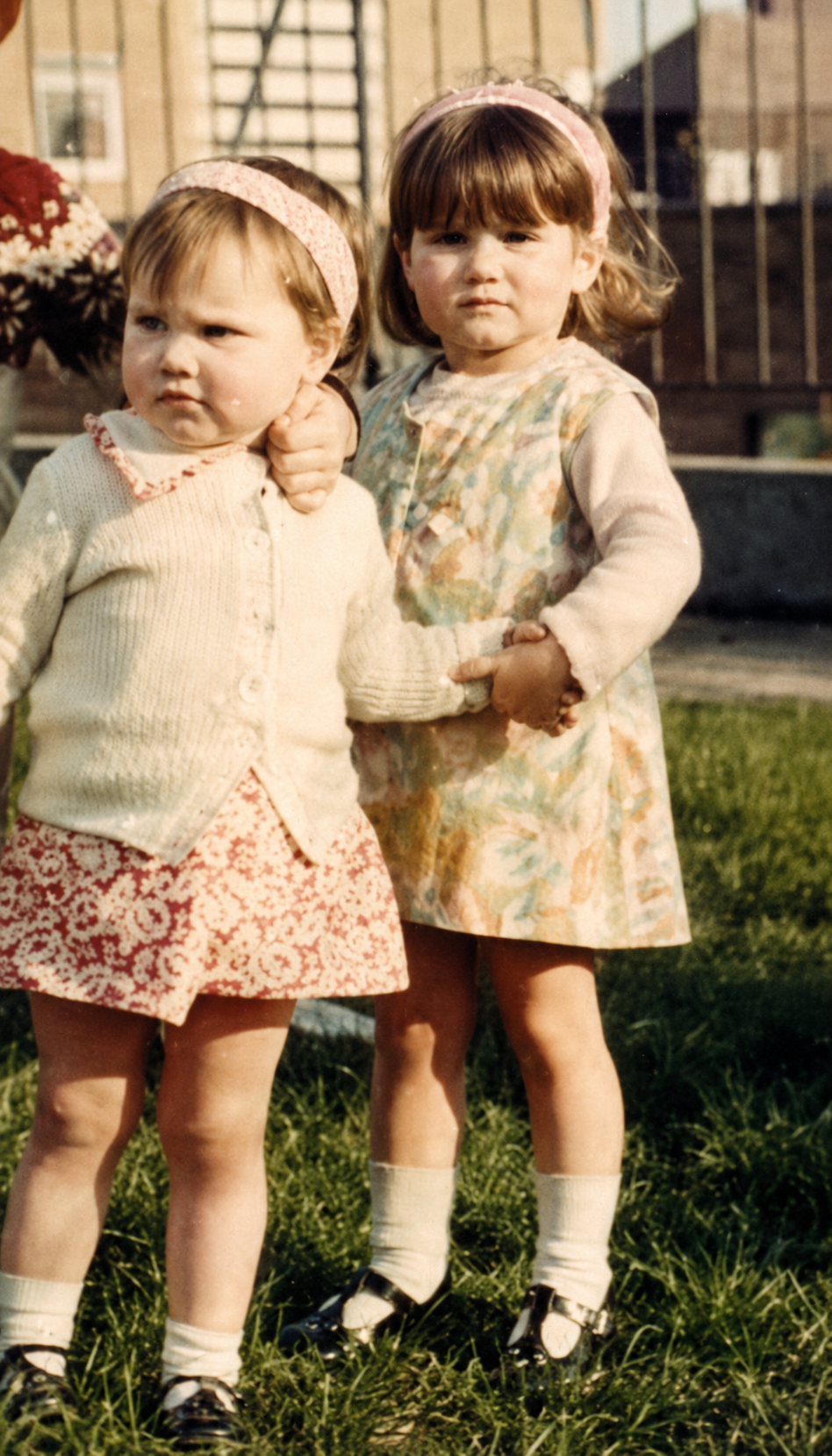 Caryn as a young child with her sister Jenny